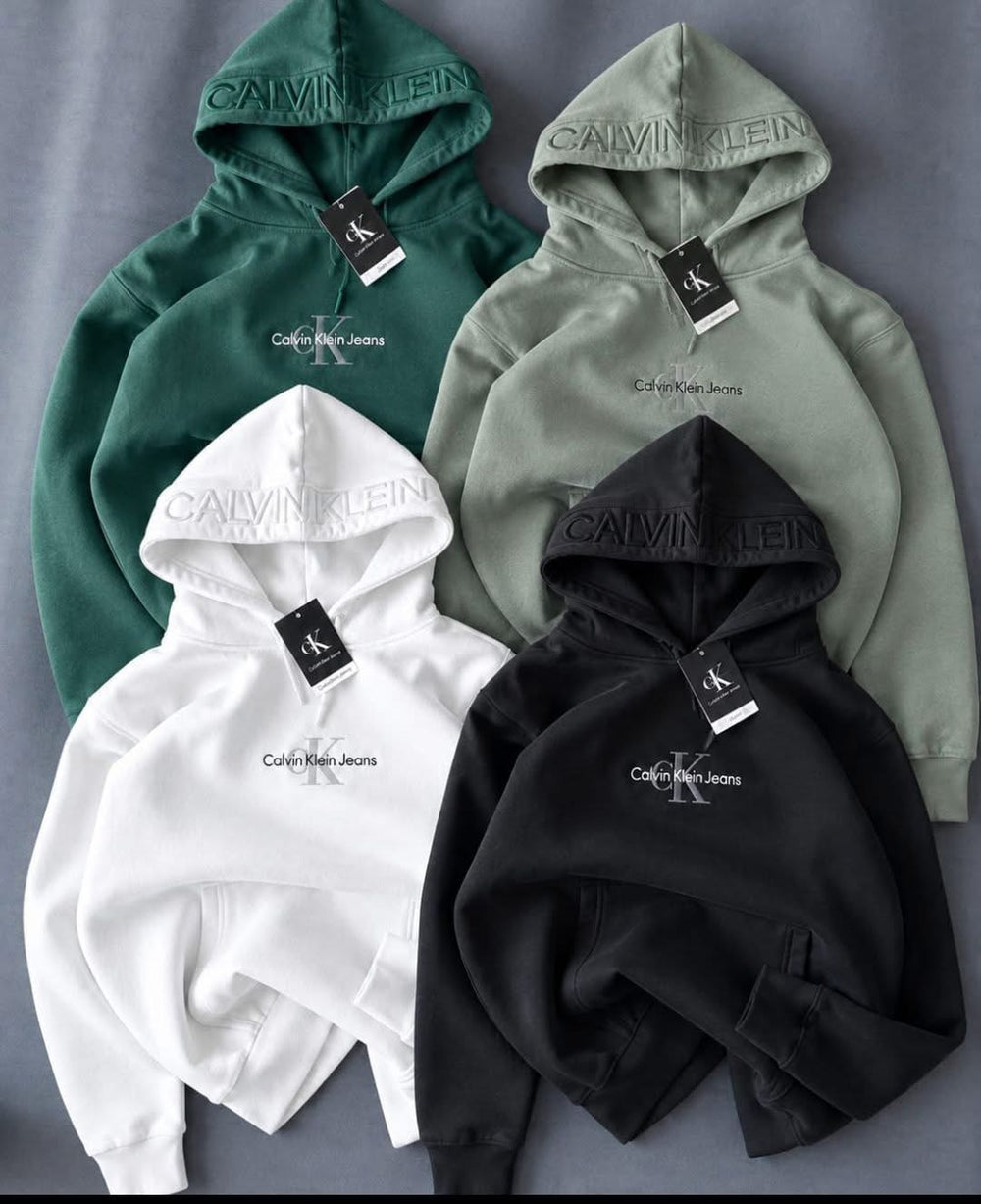 Four pullover hoodies in green, grey, white and black