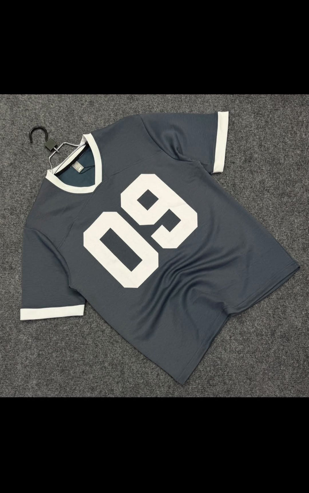 Grey short-sleeve sports jersey with a large 09 print